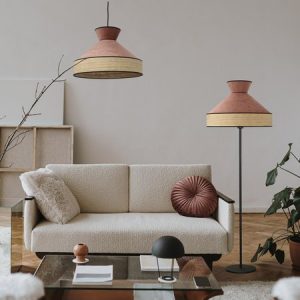 Elegant Scandinavian hygge style home living room interior: comfortable sofa, pillow, white walls, home plants. Aesthetic luxury bright apartment interior design concept